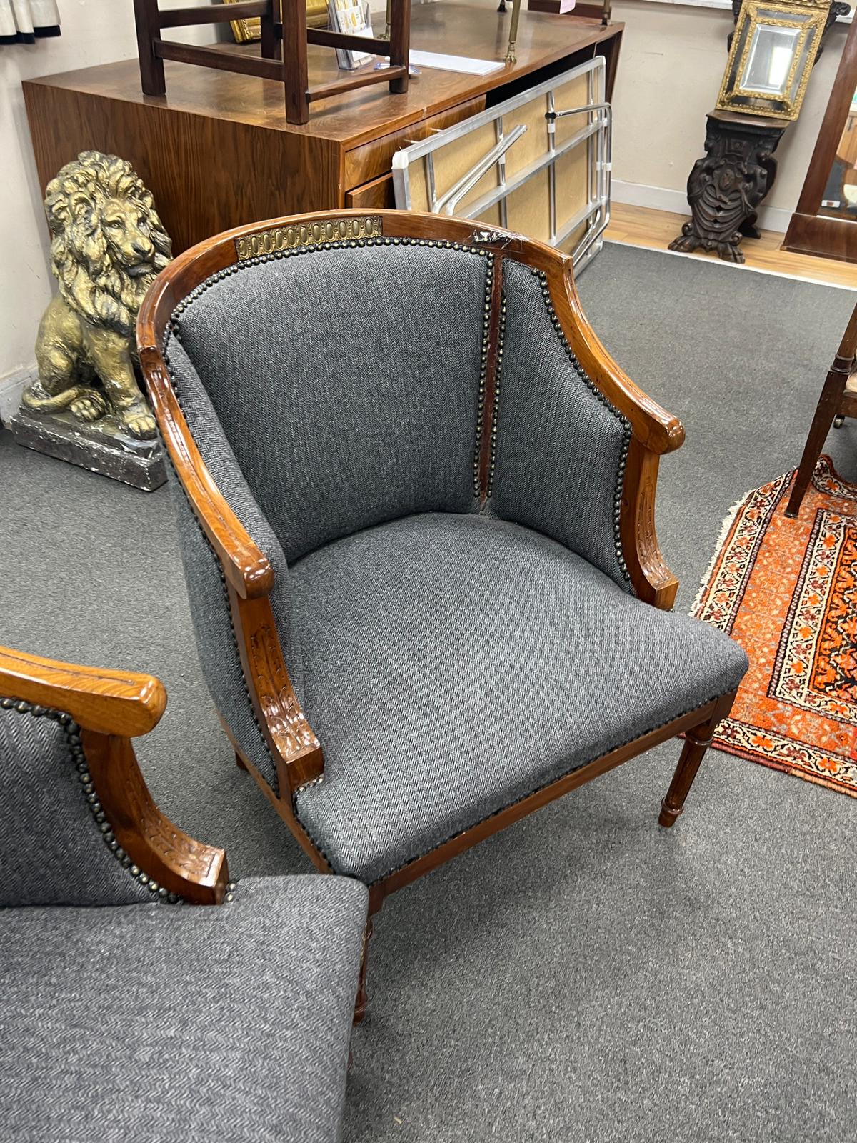 A pair of French Empire style gilt metal mounted upholstered mahogany tub framed chairs, width 62cm, depth 60cm, height 71cm